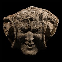 Medieval Limestone Gargoyle of a Smiling Horned Devil