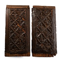 Pair of Carved Wainscot Panels with Fleurs-de-Lys and Geometric Trellis Motifs