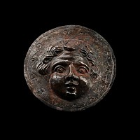 Roman Silver Phalera with Face of Eros, the Greek God of Love
