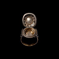 Diamond Locket Ring Set with Emerald Intaglio of Eros, the Greek God of Love, Playing Aulos