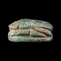 Phoenician Blue Glazed Faience Scaraboid with Winged Beast and Tree