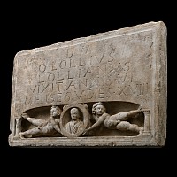 Roman Limestone Stele with Nude Putti