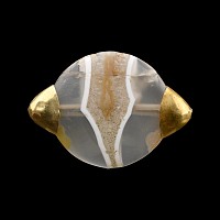 An Exceptional Western Asiatic Banded Agate Bead with Gold Caps