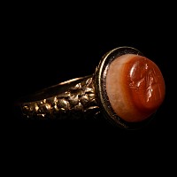 Roman Carnelian Onyx Gemstone of a Seated Muse Set into a Gold Georgian Ring
