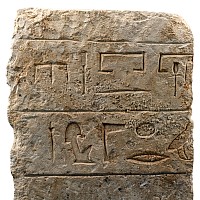 Egyptian Limestone Relief with Painted Head and Hieroglyphics