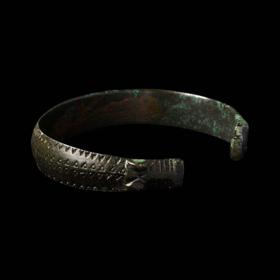 Viking Age Bronze Stamped Bracelet with Beast Head Terminals