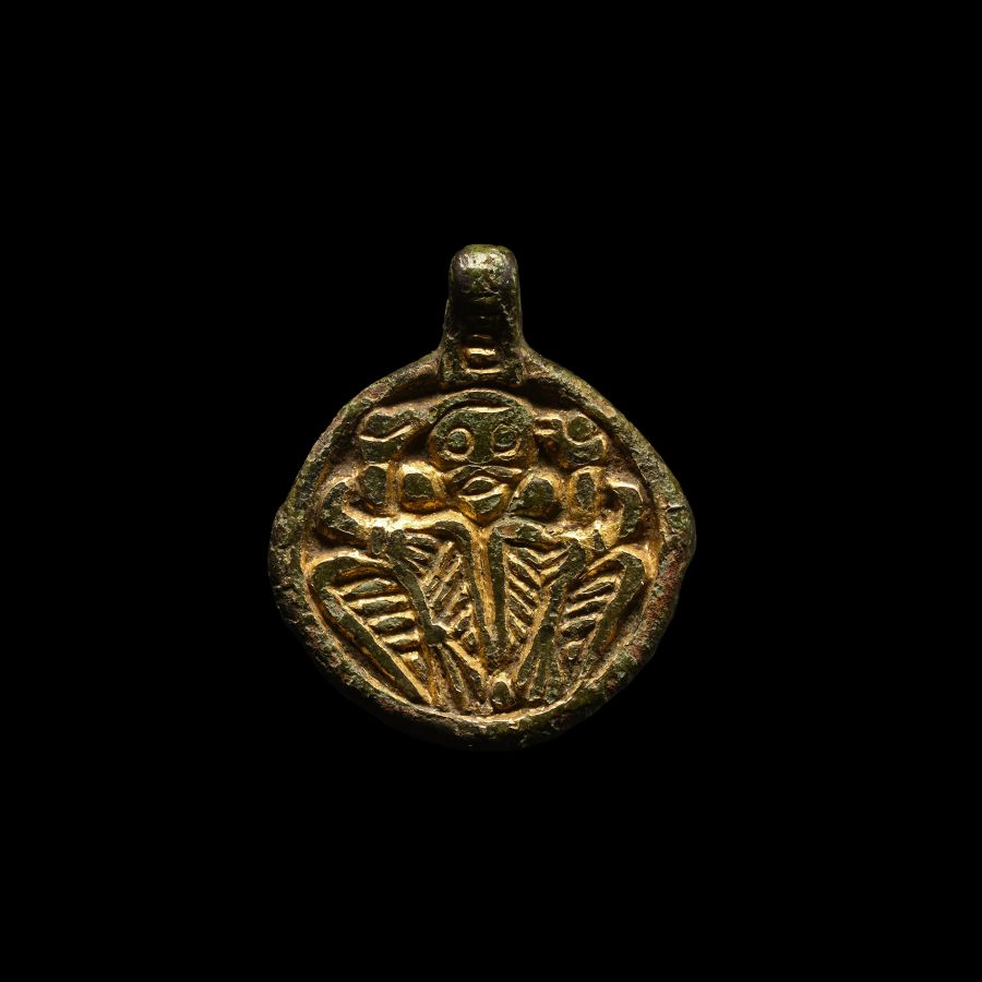Viking Silver-Gilt Pendant with Odin Gripping Two Ravens