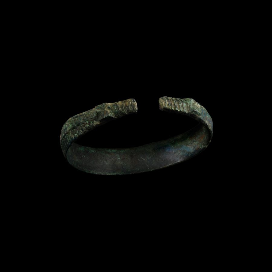 Viking Age Bronze Stamped Bracelet with Beast-Head Terminals
