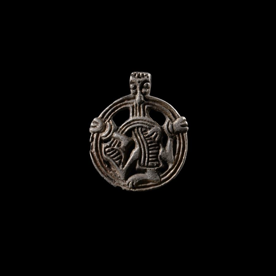 Viking Age Silver Pendant with Gripping Beast