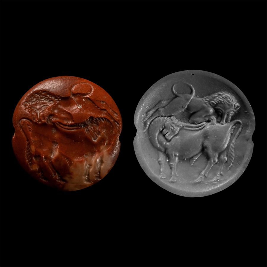 Minoan Red Jasper Seal Depicting a Lion Attacking a Bull