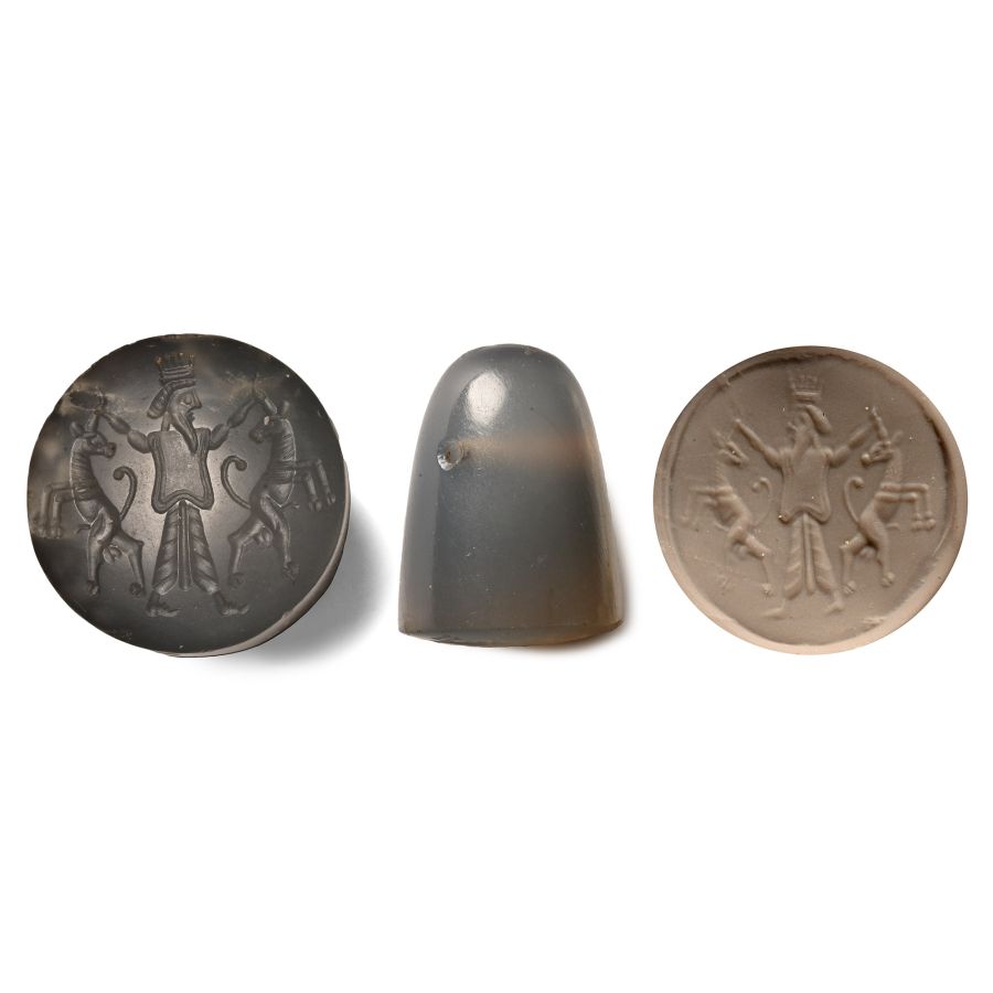Persian Chalcedony Stamp Seal of a Persian King Gripping the Horns of Two Goats