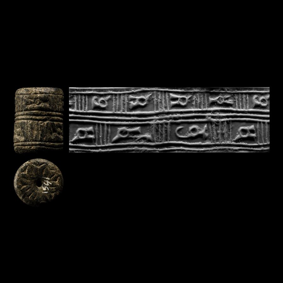 Early Syrian Black Stone Cylinder Seal with Animals