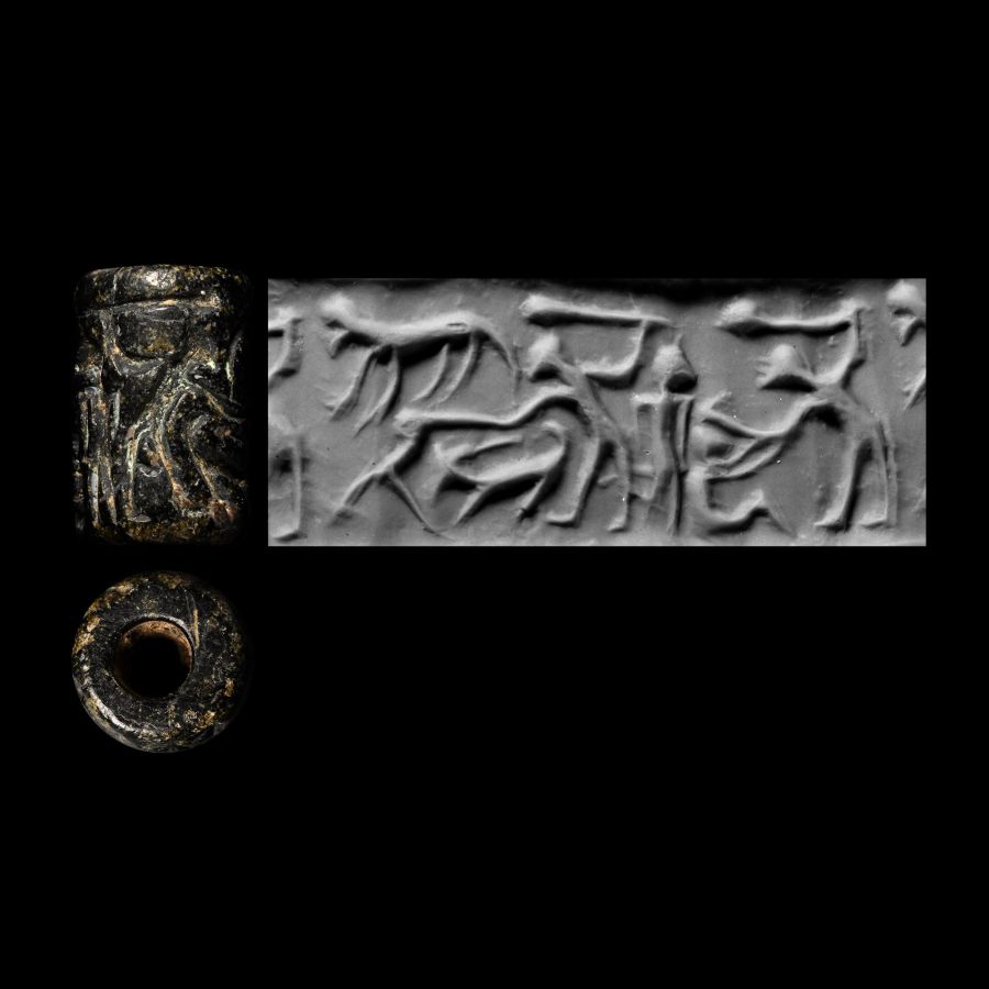 Anatolian Black Stone Cylinder Seal with Figures Holding Clubs