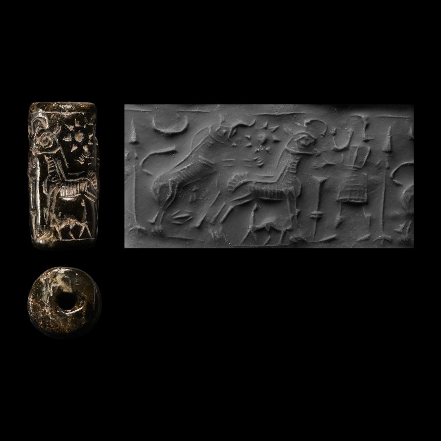 Neo-Assyrian Black Stone Cylinder Seal with Bull and Cow
