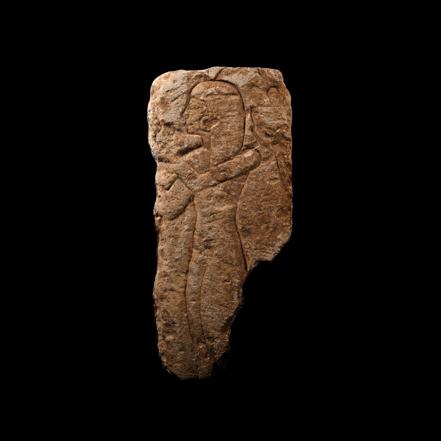 Egyptian Limestone Relief Fragment with Female Figure