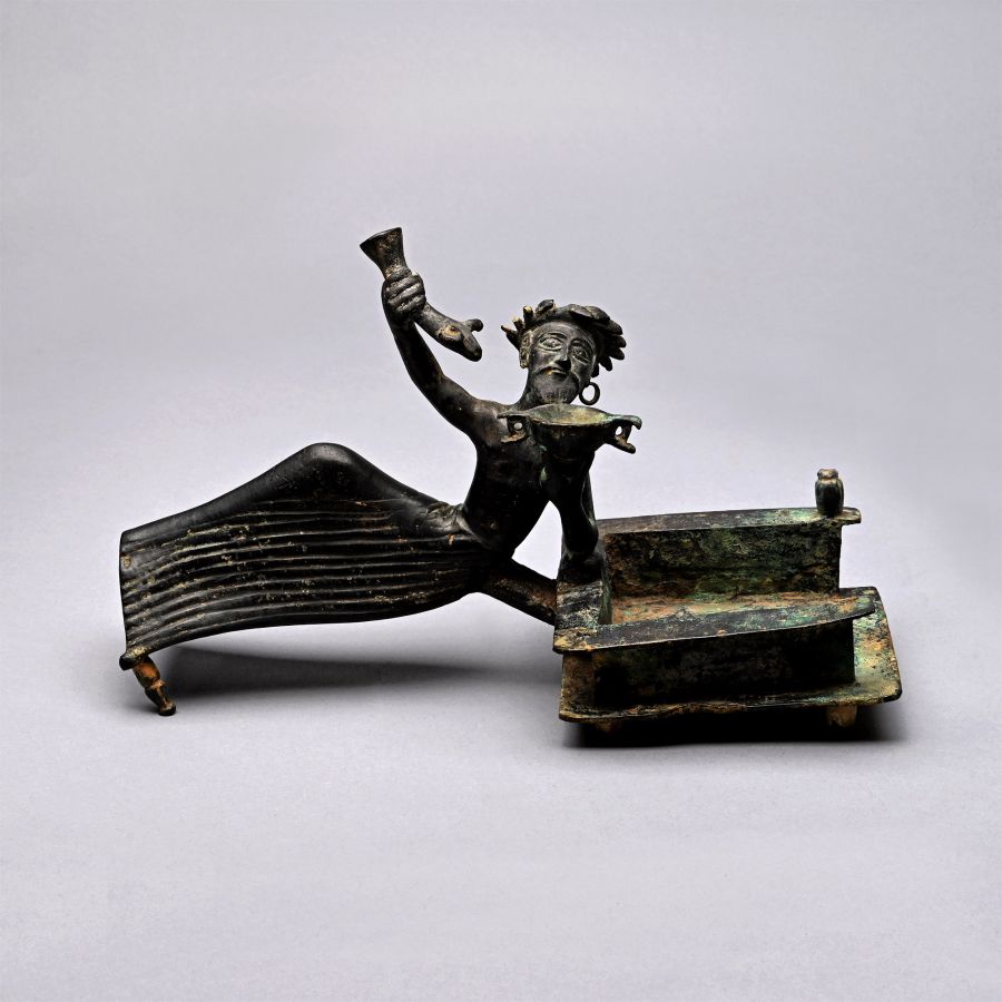 Bronze Batillum Depicting a Reclining Banqueteer with Skyphos and Rhyton