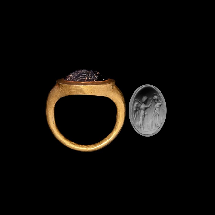 Roman Gold Ring with Cabochon Garnet Gemstone with the Goddesses Athena and Nike