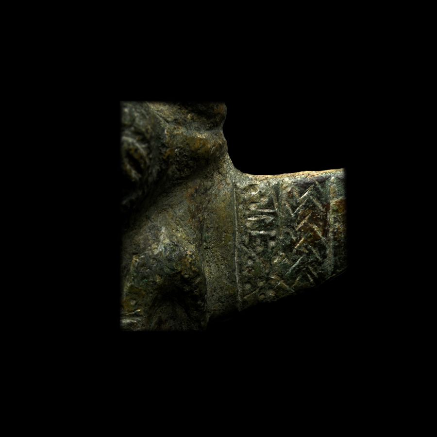 Elamite Bronze Macehead with Winged Human and Animal Figure