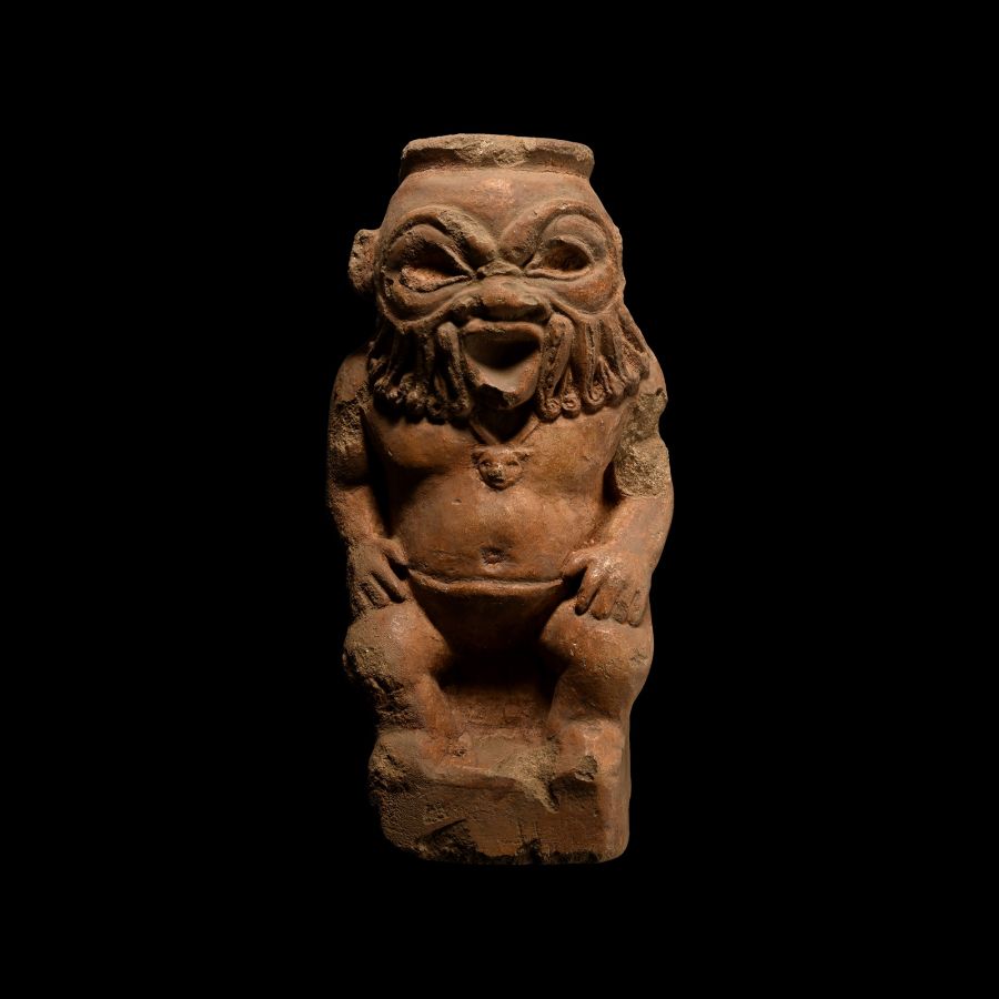 Egypto-Roman Seated Limestone Statuette of Bes
