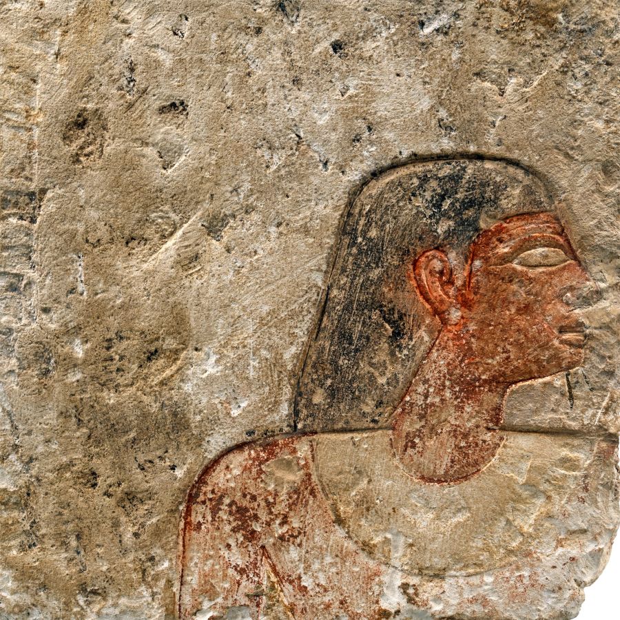 Egyptian Limestone Relief with Painted Head and Hieroglyphics